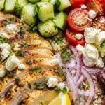 Mediterranean chicken and quinoa lunch bowl with cucumber, tomatoes, and feta